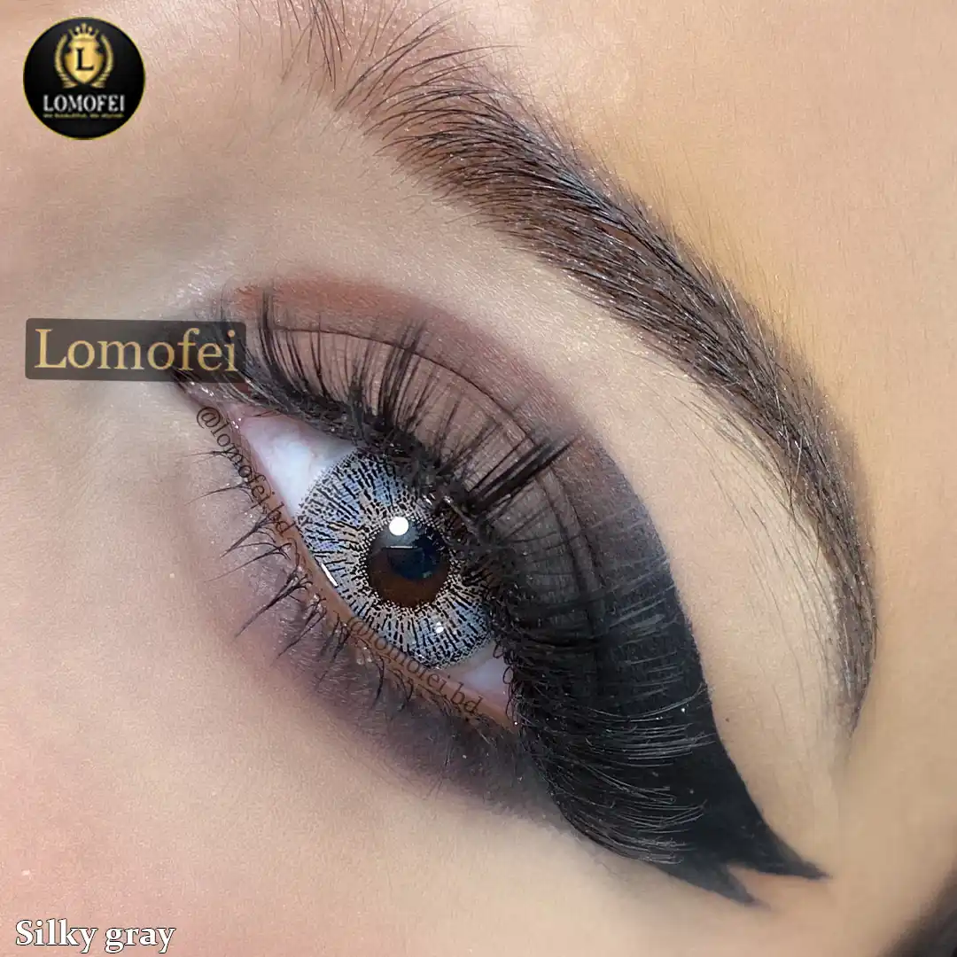 A model wearing Bella Elite Silky Gray Fashion Colour Eye Lenses, close-up view of the eye with high definition.