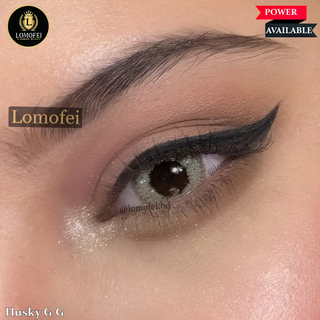 A model wearing Bella Glow Husky Gray Green Prescription Power Contact Lenses, close-up view of the eye with high definition.