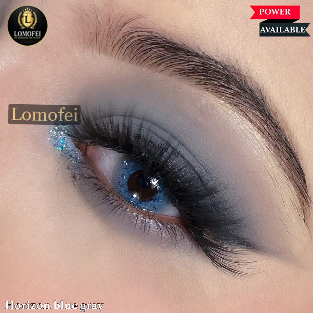 A model wearing Bella Elite Horizon Blue Gray Fashion Colour Contact Lenses, close-up view of the eye with high definition.