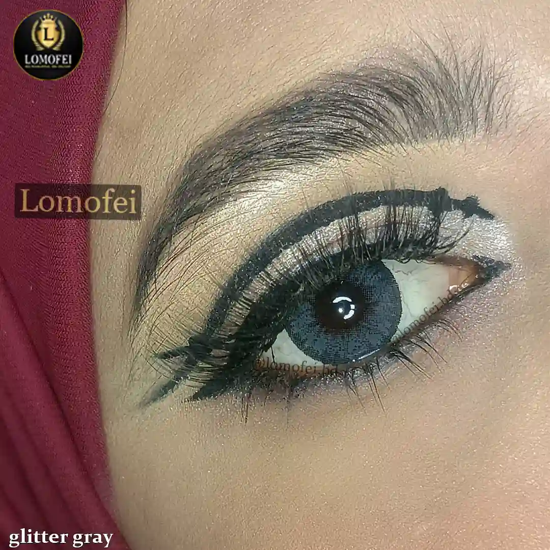 A model wearing Bella Diamonds Glitter Gray Fashion Colour Eye Lenses, close-up view of the eye with high definition.